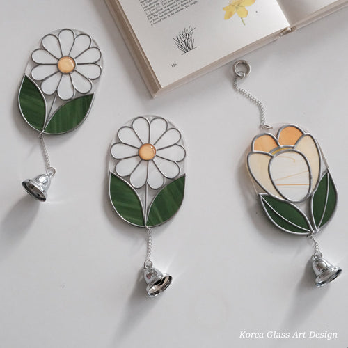 Handmade Korean Glass Art flower suncatchers created during a workshop.
