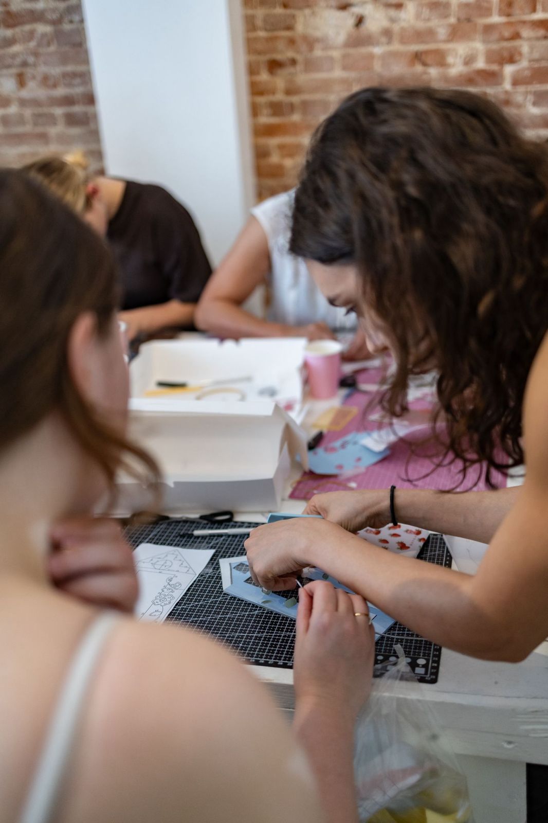 Participants creating Korean Glass Art during a hands-on group workshop in Dresden